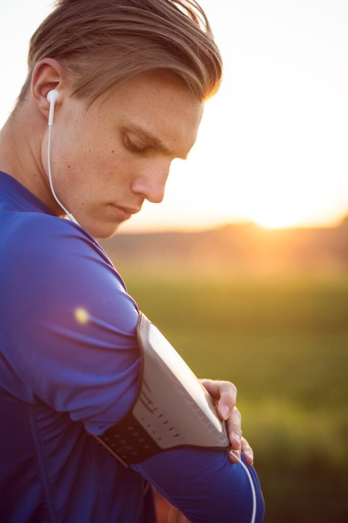 Portrait of young man checking blood pressure on wearable device